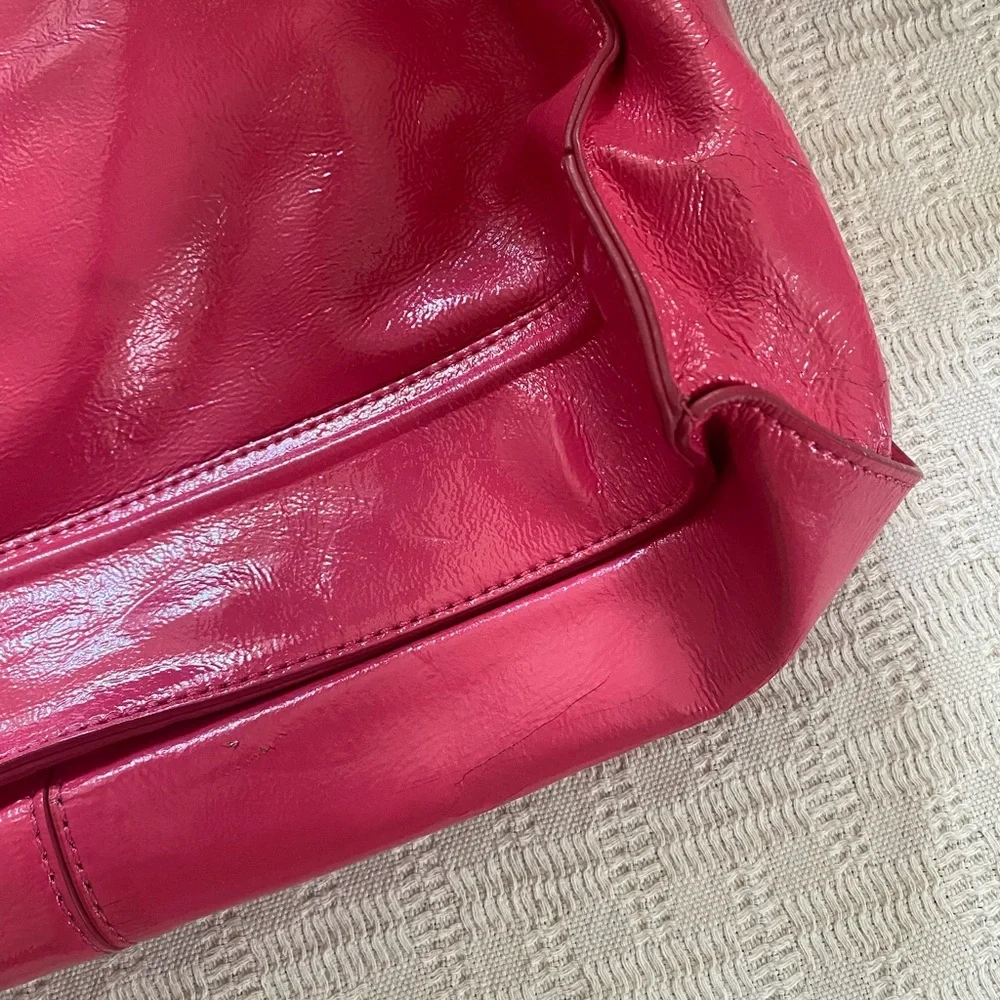 Cole Haan pink patent leather purse.